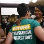 Democratic congressional nominee Ayanna Pressley embraced Bridget Schaaff, a federal policy fellow with the National LGTBQ Task Force.