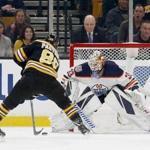 Boston Bruins right wing David Pastrnak (88) scores a goal against Edmonton Oilers goaltender Cam Talbot (33) during the first period of an NHL hockey game Thursday, Oct. 11, 2018, in Boston. (AP Photo/Mary Schwalm)