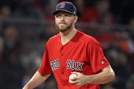 Boston, MA: 10-13-18: Red Sox starting pitcher Chris Sale is pictured as he struggled with his control in the top of the second inning. The Boston Red Sox hosted the Houston Astros in Game One of their ALCS baseball matchup at Fenway Park. (Jim Davis/Globe Staff)
