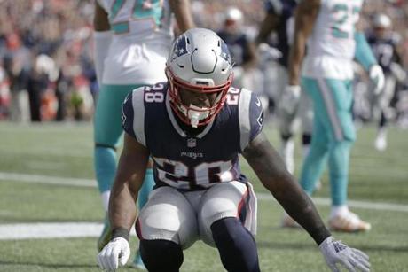 New England Patriots running back James White celebrates his touchdown against the Miami Dolphins during the first half of an NFL football game, Sunday, Sept. 30, 2018, in Foxborough, Mass. (AP Photo/Steven Senne)
