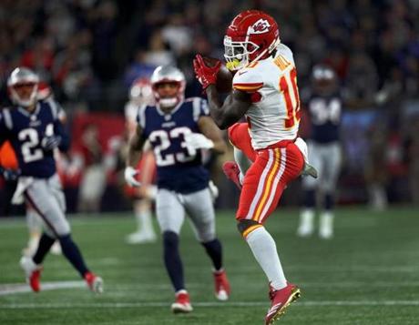 Foxborough, MA - 10/14/2018 - (4th quarter) Kansas City Chiefs wide receiver Tyreek Hill (10) leaps to make a long touchdown reception that tied the game at 40-40 late in the fourth quarter. The New England Patriots host the Kansas City Chiefs in a Sunday night NFL game at Gillette stadium in Foxborough. - (Barry Chin/Globe Staff), Section: Sports, Reporter: Jim McBride, Topic: 15Patriots-Chiefs, LOID: 8.4.3482575762.
