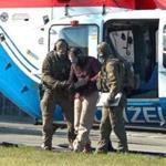 Police officers escorted Mounir el Motassadeq after he was brought via helicopter to the airport in Hamburg.