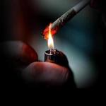 Man smoking marijuana cigarette soft drug in Amsterdam, Netherlands; Shutterstock ID 259315754; PO: oped