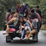 Honduran immigrants, part of a migrant caravan, traveled north near Quezaltepeque, Guatemala. 