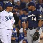 Manny Machado and Jesus Aguilar exchange words during the 10th inning. 