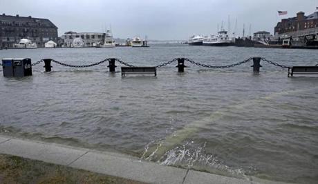 Christopher Columbus Park on the waterfront flooded during a March storm. 
