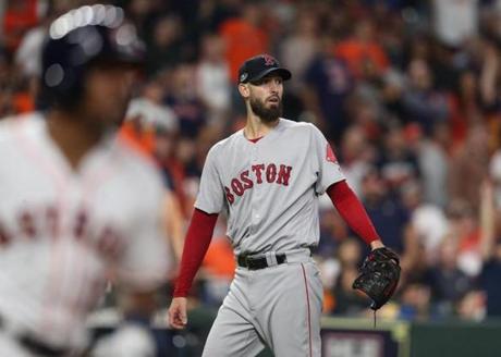 Houston TX 10/17/18: Red Sox pitcher Rick Porcello reacts after Astros Tony Kemp solo home run in the fourth inning. Kemp (left) rounds the bases. Houston Astros hosted Boston Red Sox in Game Four of ALCS at Minute Maid Park Wednesday, Oct. 17, 2018. (Jim Davis//Globe Staff)
