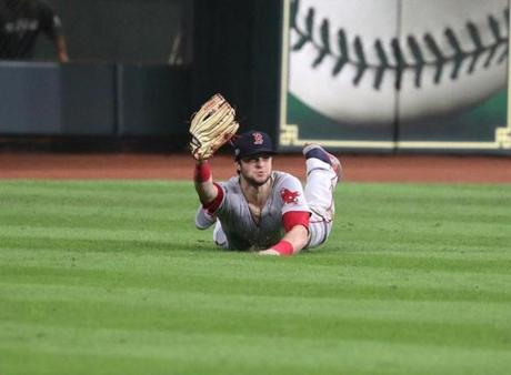 Houston TX 10/18/18: Red Sox Andrew Benintendi catches a fly ball from Astros Alex Bregman for the last out in the ninth inning. Houston Astros hosted Boston Red Sox in Game Four of ALCS at Minute Maid Park Wednesday, Oct. 18, 2018. (Barry Chin//Globe Staff)
