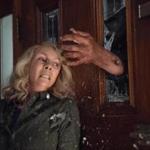 Laurie Strode (Jamie Lee Curtis) barricades herself inside her home (to no avail) in 