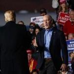 US Representative Greg Gianforte, R-Mont., was greeted on stage by President Donald Trump during a campaign rally at Minuteman Aviation Hangar on Thursday in Missoula, Mont. 