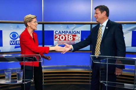 Massachusetts Senate candidates Sen. Elizabeth Warren, left, and her opponent State Rep. Geoff Diehl shake hands before a debate in Boston, Friday, Oct. 19, 2018. (AP Photo/Michael Dwyer)
