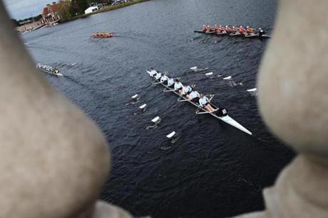 Crews of eight raced up the Charles River after passing under a bridge at the Head of the Charles Regatta on Saturday.
