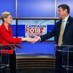 Massachusetts Senate candidates Sen. Elizabeth Warren, left, and her opponent State Rep. Geoff Diehl shake hands before a debate in Boston, Friday, Oct. 19, 2018. (AP Photo/Michael Dwyer)