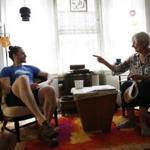 Dean Kaplan and Sarah Heintz chatted in the apartment they share in Cambridge.