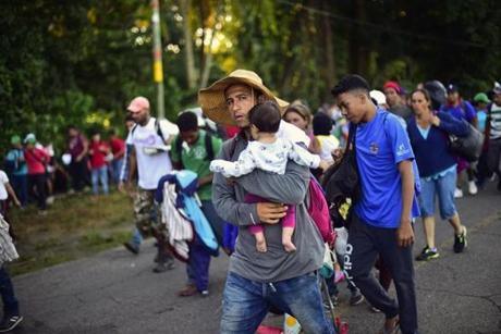Honduran migrants heading in a caravan to the US walked in Metapa on their way to Tapachula, Chiapas state, Mexico on Monday President Donald Trump on Monday called the migrant caravan heading toward the US-Mexico border a national emergency, saying he has alerted the US border patrol and military. 
