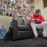 Boston, Ma- October 21, 2018-Stan Grossfeld/ Globe Staff?Practice before Game 1 of World Series-Alex Cora maps out his World Series plans in front of his wall of wins in his office.