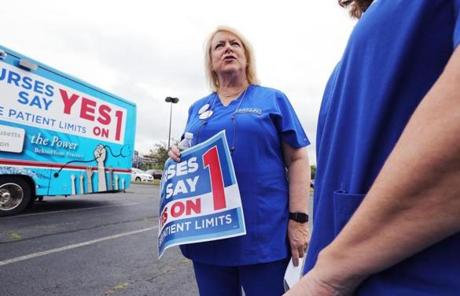 Somerville, MA - 8/21/18 - Donna Kelly-Williams (cq), president of the Massachusetts Nurses Association (cq), chats after the speeches. Nurses rally near Partners HealthCare (cq), in Somerville. The MNA backs ballot initiative #1, that mandates minimum levels of nurse staffing statewide. Photo by Pat Greenhouse/Globe Staff Topic: 22campaignnotes Reporter: Priyanka McCluskey
