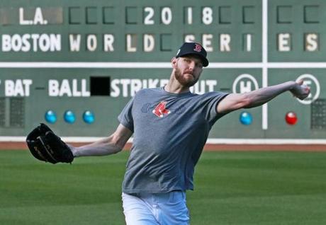 Boston, MA 10-22-18: Red Sox Game One starting pitcher Chris Sale got in some throwing in the outfield this afternoon. The Boston Red Sox and the Los Angeles Dodgers both held media availabilities and workouts at Fenway Park in anticipation of Tuesday night's Game One of the World Series. (Jim Davis/Globe Staff) 
