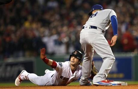 RED SOX SLIDER23 Boston, MA - 10/23/2018 - Red Sox Andrew Benintendi calls for a time out after advancing to second base in the first inning. The Boston Red Sox host the LA Dodgers in Game 1 of the World Series at Fenway Park. (Barry Chin/Globe Staff)
