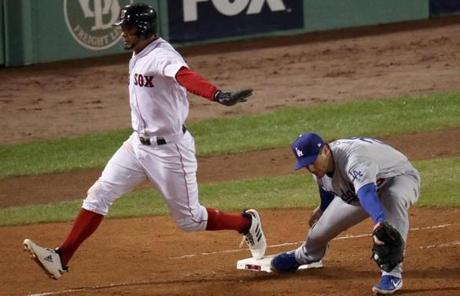 RED SOX SLIDER23 Boston, MA - 10/23/2018 - Red Sox Xnder Bogaerts is safe after hitting a single against Dodgers David Freese in the fifth inning. The Boston Red Sox host the LA Dodgers in Game 1 of the World Series at Fenway Park. (John Tlumacki/Globe Staff)
