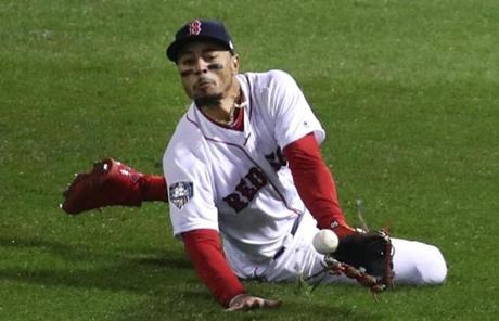 RED SOX SLIDER24 24redsoxSlider23 Boston, MA - 10/24/2018 -Mookie Betts can't come up with the catch on David Freese line drive in fourth inning of Game 2 of the World Series. The Boston Red Sox host the Los Angeles Dodgers in Game 2 of the World Series at Fenway Park. (Stan Grossfeld/Globe staff)
