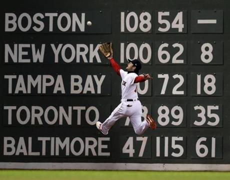 Red Sox left fielder Andrew Benintendi leaps and makes the catch to rob the Dodgers Brian Dozier of a hit in the top of the fifth inning.
