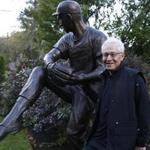 Bob Gaynor poses for a portrait next to the bronze sculpture he made of legendary Dodgers pitcher Sandy Koufax, which now resides in his front yard.