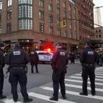 Police stood watch near a building associated with actor Robert De Niro Thursday morning.