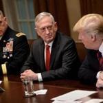 Secretary of Defense James Mattis (center) spoke with President Donald Trump before a Cabinet meeting this week. 