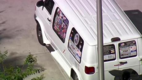 A van parked in Plantation, Fla., was examined and taken by federal agents and other law enforcement officials. 
