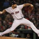 Boston, MA - 10/24/2018 - Red Sox pitcher Nathan Eovaldi pitches in the eighth inning. The Boston Red Sox host the LA Dodgers in Game 2 of the World Series at Fenway Park. (Barry Chin/Globe Staff)