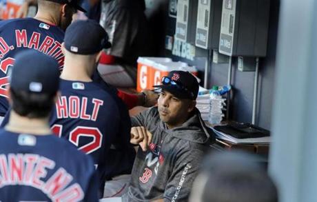 Los Angeles, CA - 10/26/2018 - Boston Red Sox manager Alex Cora in the dugout with players before Game 3 of the World Series. The Los Angeles Dodgers host the Boston Red Sox in Game 3 of the World Series at Dodger Stadium. (Jim Davis/Globe staff)
