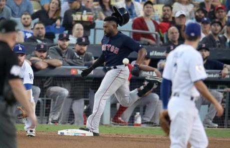 RED SOX SLIDER26 Boston, MA - 10/26/2018 - Red Sox Jackie Bradley Jr. makes it to first base in the third inning. Los Angeles Dodgers hosted the Boston Red Sox in Game 3 of the World Series at Dodger Stadium. (Stan Grossfeld/Globe Staff)
