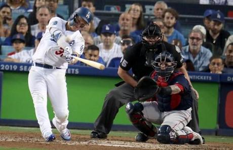 RED SOX SLIDER26 Boston, MA - 10/26/2018 - Dodgers Joc Pederson hits a solo home run in the third inning. Los Angeles Dodgers hosted the Boston Red Sox in Game 3 of the World Series at Dodger Stadium. (Stan Grossfeld/Globe Staff)
