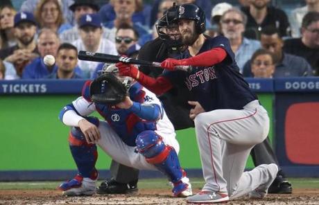 RED SOX SLIDER26 Boston, MA - 10/26/2018 - Red Sox pitcher Rick Porcello sacrifice bunts in the third inning. Los Angeles Dodgers hosted the Boston Red Sox in Game 3 of the World Series at Dodger Stadium. (Stan Grossfeld/Globe Staff)
