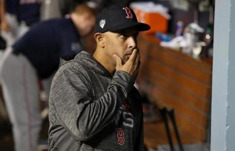 RED SOX SLIDER26 Los Angeles, CA - 10/26/2018 - Alex Cora ponders his next move in the sixteenth inning in Game 3 of the World Series. The Los Angeles Dodgers host the Boston Red Sox in Game 3 of the World Series at Dodger Stadium. (Jim Davis/Globe staff)
