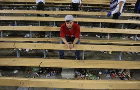 RED SOX SLIDER26 Los Angeles, CA - 10/27/2018 - A dejected Red Sox fan Hugo Chavez of New Mexico after the game. The Dodgers defeated the Red Sox 3-2. Los Angeles Dodgers hosted the Boston Red Sox in Game 3 of the World Series at Dodger Stadium. (Stan Grossfeld/Globe Staff)

