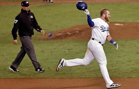 RED SOX SLIDER26 Los Angeles, CA - 10/27/2018 - (18th inning) Los Angeles Dodgers first baseman Max Muncy (13) celebrates his game winning home run that broke a 2-2 tie in the eighteenth inning. The Los Angeles Dodgers host the Boston Red Sox in Game 3 of the World Series at Dodger Stadium. - (Barry Chin/Globe Staff), Section: Sports, Reporter: Peter Abraham, Topic: 27Dodgers-Red Sox, LOID: 8.4.3624881052.
