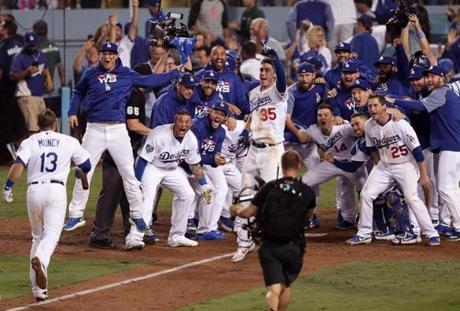 Los Angeles, CA - 10/27/2018 - (18th inning) Los Angeles Dodgers first baseman Max Muncy (13) celebrates his game winning home run that broke a 2-2 tie in the eighteenth inning. The Los Angeles Dodgers host the Boston Red Sox in Game 3 of the World Series at Dodger Stadium. - (Barry Chin/Globe Staff), Section: Sports, Reporter: Peter Abraham, Topic: 27Dodgers-Red Sox, LOID: 8.4.3624881052.
