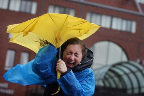Lauren Gorney of Wilkes-Barre, Pa., battled wind and rain on her way to the New England Aquarium.
