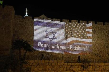 People walk under the US and the Israeli flags projected on the walls of Jerusalem d city on October 28, 2018, organised by Jerusalem municipality to show solidarity with the Pittsburgh Jewish community following the shooting attack at the Tree of Life synagogue in Pittsburgh, Pennsylvania. (Photo by Menahem KAHANA / AFP)MENAHEM KAHANA/AFP/Getty Images
