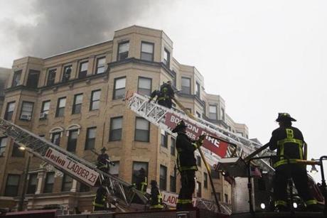 Boston, MA - 10/27/2018- ] Firefighters battle a fire in an apartment building at 104 Hemenway St in Boston on Saturday. (Michael Swensen for The Boston Globe) Topic: () 
