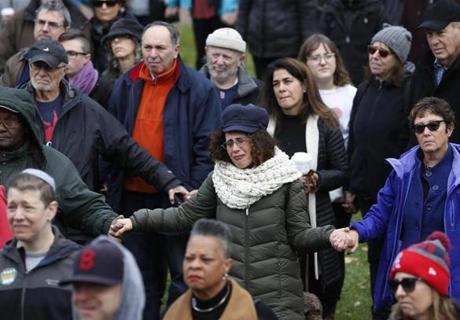 The crowd joined hands during a vigil for Bostonians to stand with the Pittsburgh Jewish community after the mass shooting at a synagogue there.
