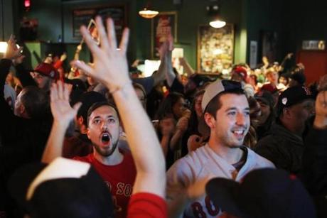 Brighton, MA - 10/28/2018- ] Red Sox fans celebrate after a home run at The Bleacher Bar on Sunday, October 28, 2018. (Michael Swensen for The Boston Globe) Topic: (sports) 
