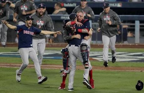 RED SOX SLIDER28 Los Angeles, CA - 10/28/2018 - Christian Vazquez and Chris Sale celebrate after The Red Sox win the World Series. The Los Angeles Dodgers host the Boston Red Sox in Game 5 of the World Series at Dodger Stadium. (Barry Chin/Globe staff)
