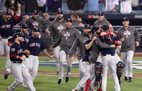 RED SOX SLIDER28 Los Angeles, CA - 10/28/2018 - (9th inning) Boston Red Sox starting pitcher Chris Sale (41), Boston Red Sox catcher Christian Vazquez (7) and teammates celebrate their Word Series Championship 5-1 win over the Los Angeles Dodgers. The Los Angeles Dodgers host the Boston Red Sox in Game 5 of the World Series at Dodger Stadium. - (Barry Chin/Globe Staff), Section: Sports, Reporter: Peter Abraham, Topic: 29Dodgers-Red Sox, LOID: 8.4.3639571384.
