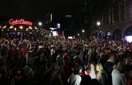 Brighton, MA - 10/28/2018- ] Red Sox fans gather outside of Fenway after the Red Sox won the World Series against the LA Dodgers on Sunday, October 28, 2018. (Michael Swensen for The Boston Globe) Topic: (sports) 
