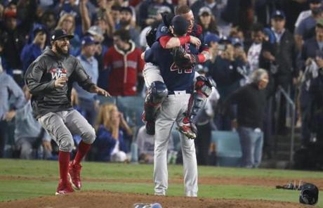 RED SOX SLIDER28 Los Angeles, CA - 10/28/2018 - David Price, Christian Vazquez and Chris Sale celebrate after The Red Sox win the World Series. The Los Angeles Dodgers host the BDavid Price, Christian Vazquez, and Chris Sale celebrated after the Red Sox defeated the Dodgers, 5-ston Red Sox in Game 5 of the World Series at Dodger Stadium. (Stan Grossfeld/Globe staff)
