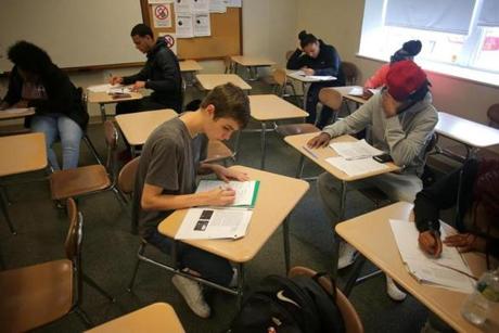 Students in the Urban Sociology class at Notre Dame Education Center in South Boston worked on an assignment last month. 
