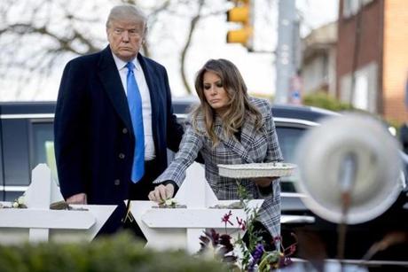 First lady Melania Trump, accompanied by President Trump, put a white flower at a memorial for those killed at the Tree of Life Synagogue in Pittsburgh on Tuesday.
